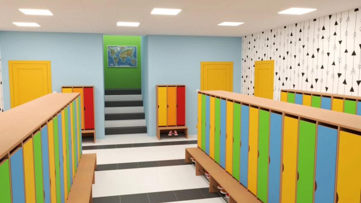 Szatnia przedszkolna z kolorowymi regałami szatniowymi i ławkami